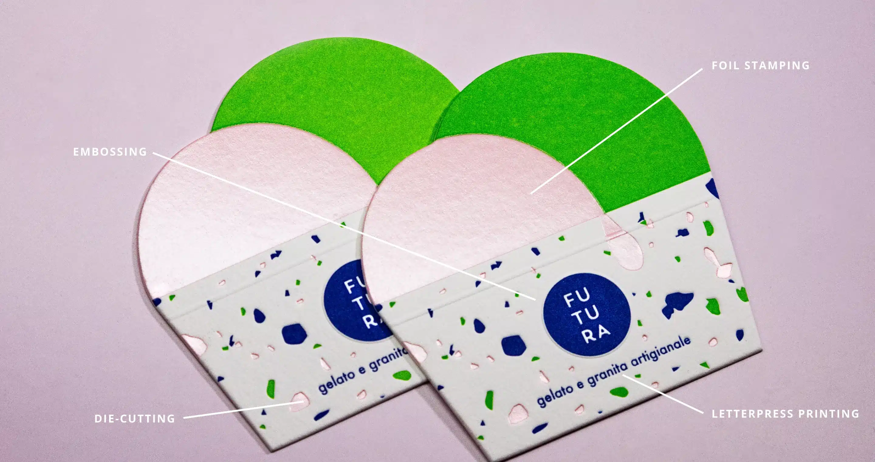 Two colorful business cards with design elements labeled: embossing, foil stamping, die-cutting, and letterpress…